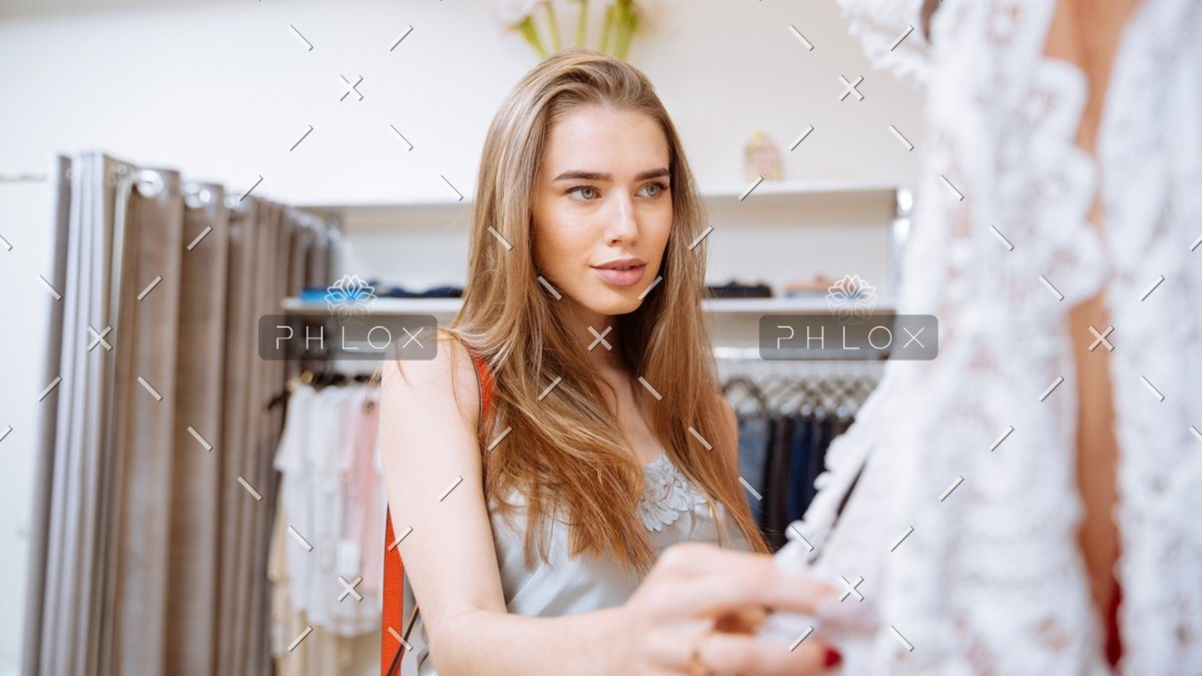 demo-attachment-141-woman-doing-shopping-and-choosing-clothes-in-PDEP6XU